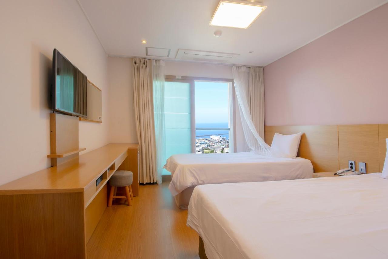 Sims Hotel Jeju Esterno foto